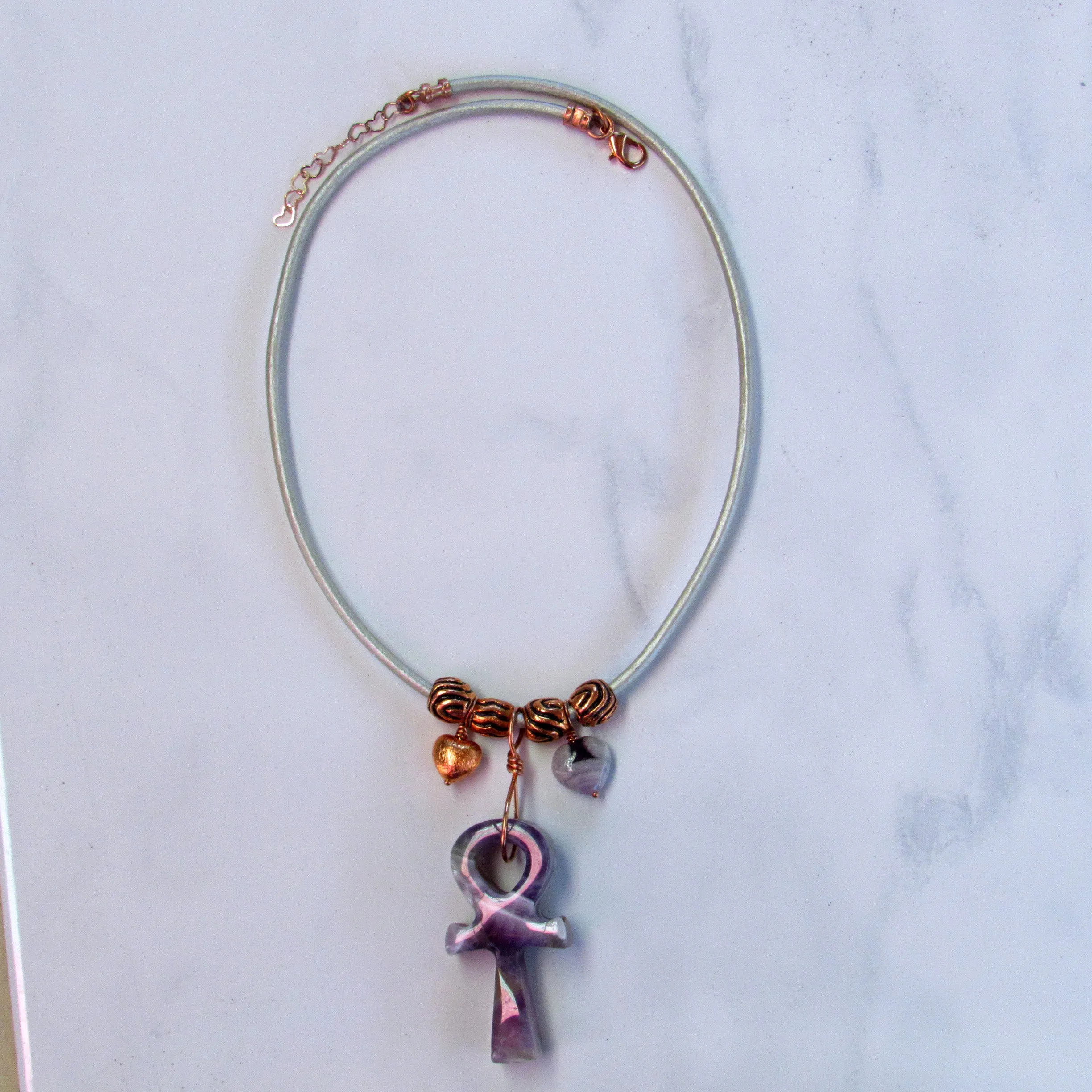 Amethyst gemstone carved Ankh pendant with copper on leather necklace