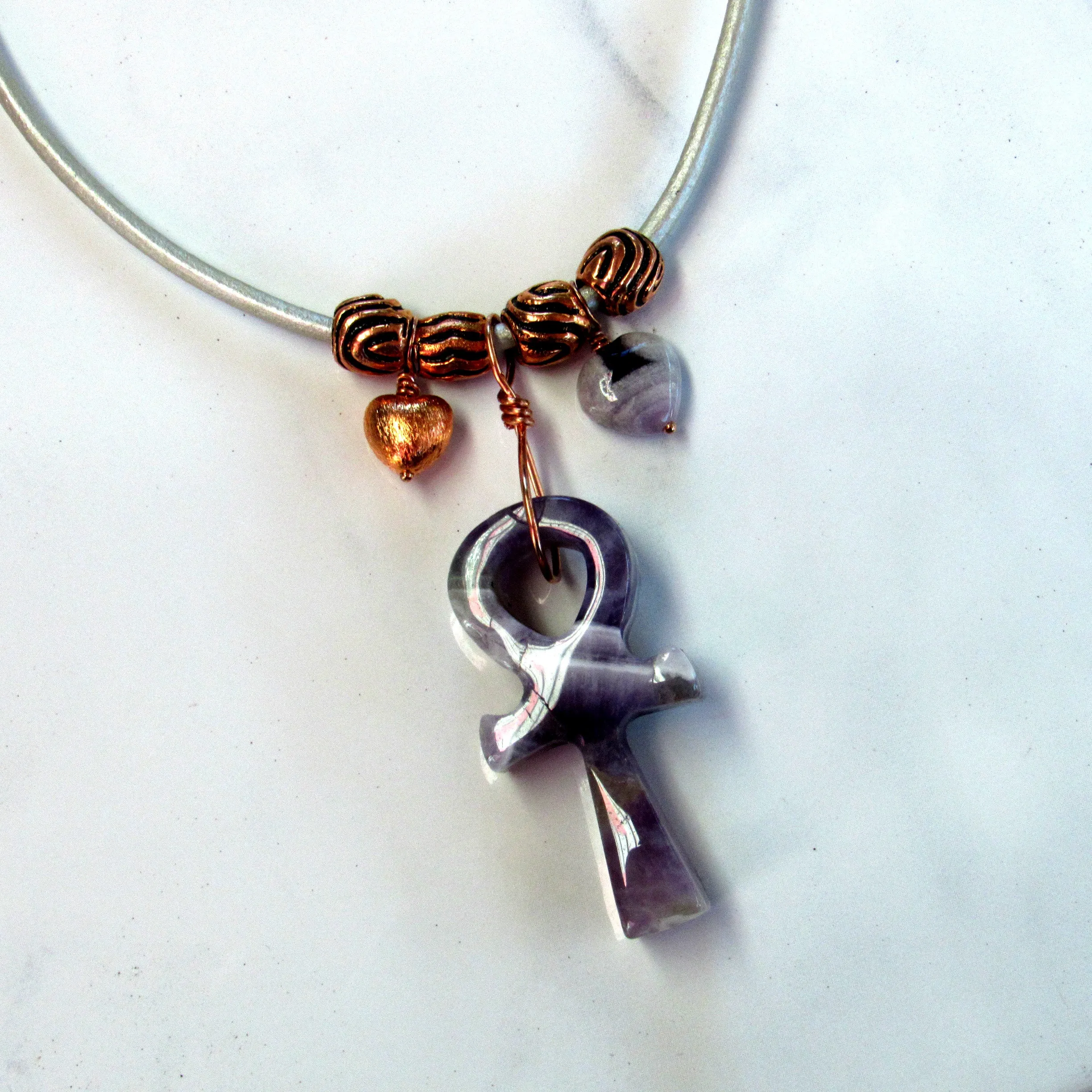 Amethyst gemstone carved Ankh pendant with copper on leather necklace